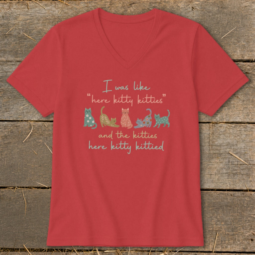 Red v-neck shirt with "I was like 'here kitty kitties' and the kitties here kitty kittied" and kittens.