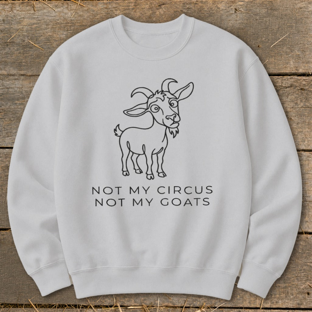 White sweatshirt with a cartoon goat and "Not My Circus Not My Goats" text.