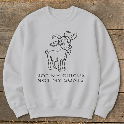 White sweatshirt with a cartoon goat and "Not My Circus Not My Goats" text.