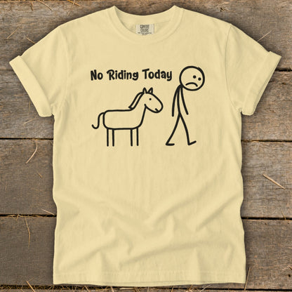 Yellow t-shirt with black text "No Riding Today" and a drawing of a sad stick figure and a horse.