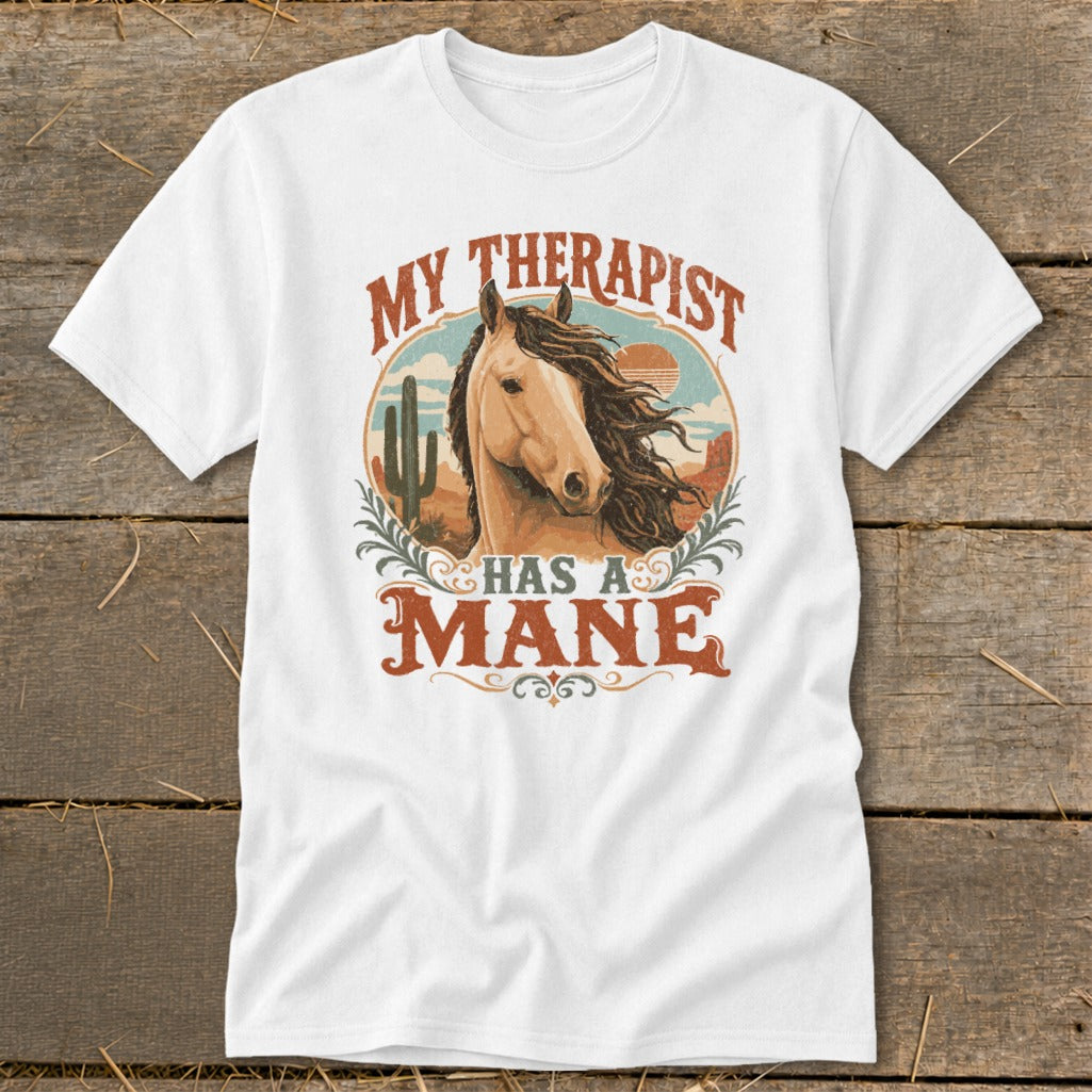 White t-shirt with graphic of horse head and text "MY THERAPIST HAS A MANE".