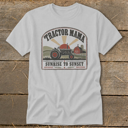 White t-shirt graphic with tractor, barn, and text "Tractor Mama Sunrise to Sunset".