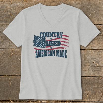 Light gray v-neck t-shirt with distressed American flag graphic and text.