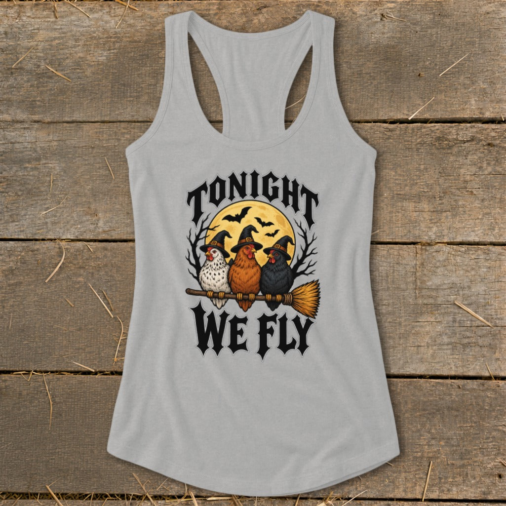 Three chickens wearing witch hats fly on a broomstick with the text "Tonight We Fly".