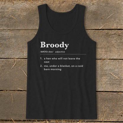 Black tank top printed with a humorous dictionary definition of the word broody against a wooden background.