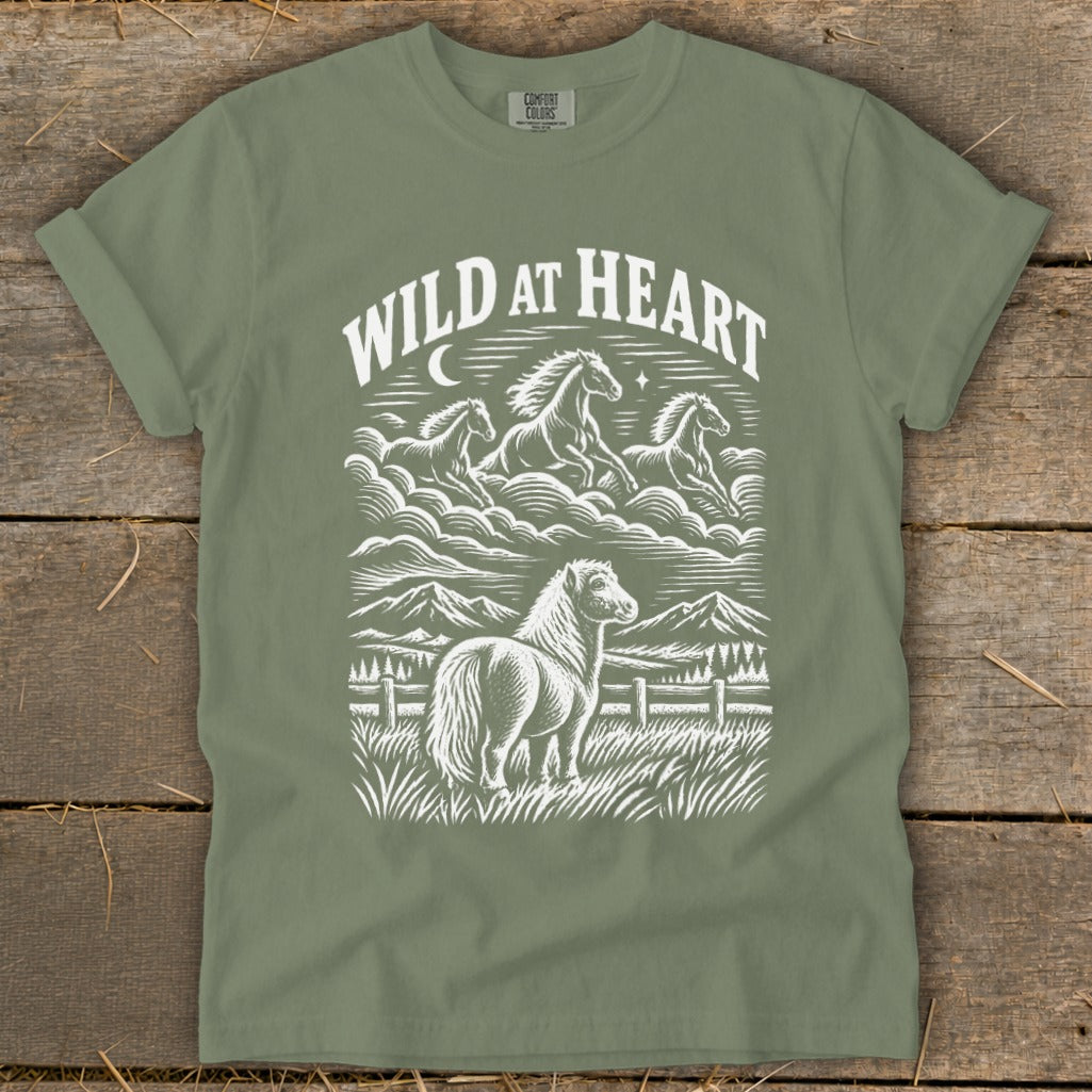 Green t-shirt with white "Wild at Heart" text and horses graphic.