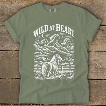 Green t-shirt with white "Wild at Heart" text and horses graphic.