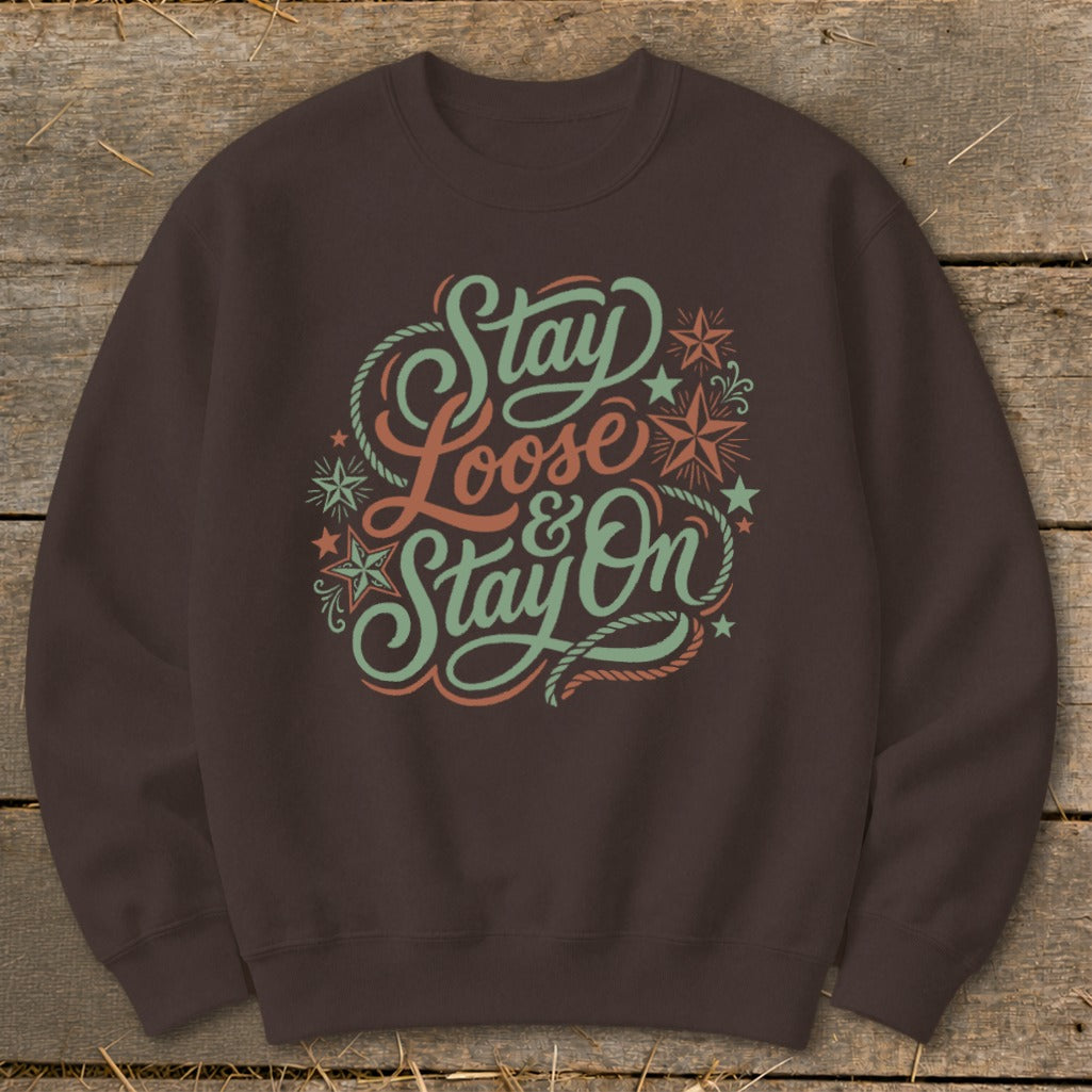 Brown sweatshirt with "Stay Loose & Stay On" text and rope and star graphics.