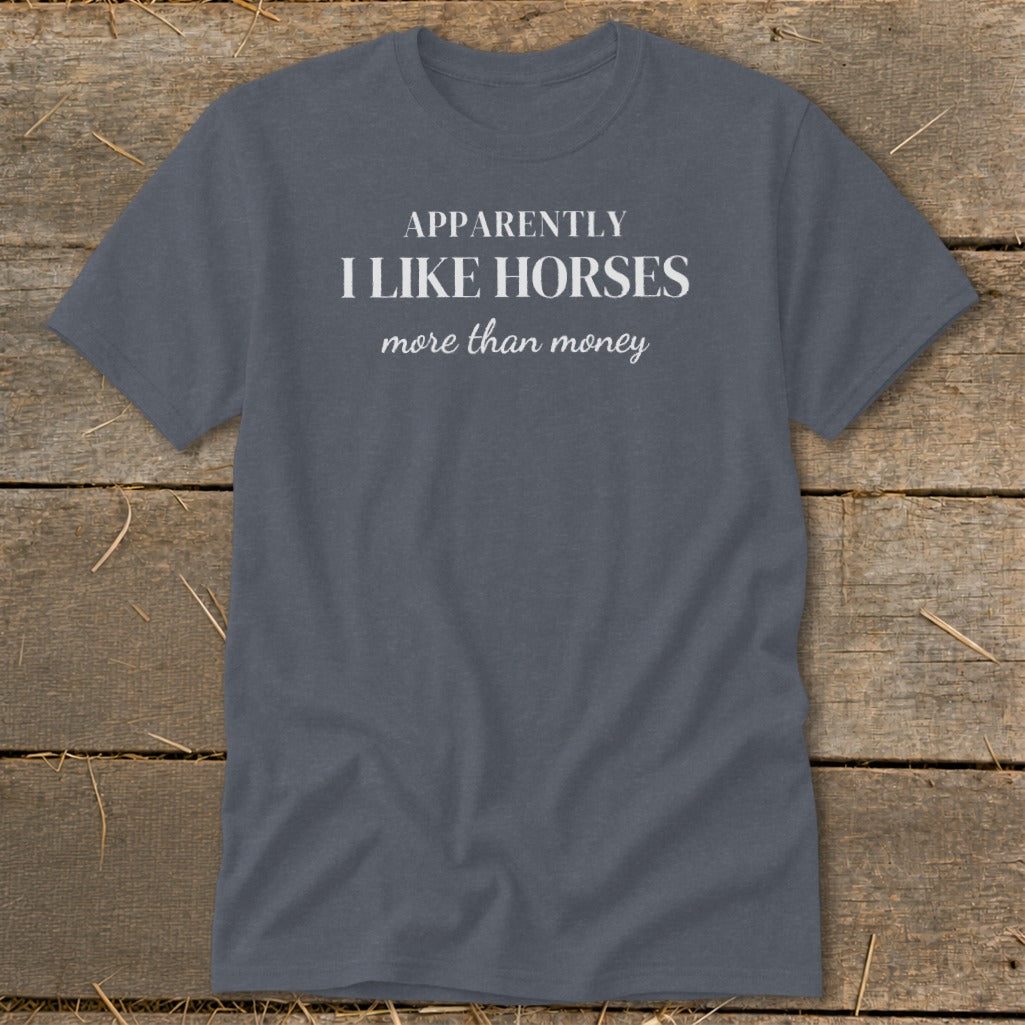 Grey t-shirt with white text: "APPARENTLY I LIKE HORSES more than money."