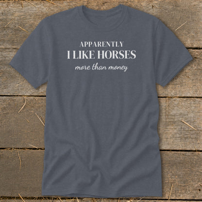 Grey t-shirt with white text: "APPARENTLY I LIKE HORSES more than money."