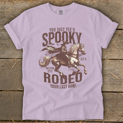 Spooky Western Style Rodeo graphic with cowboy on horse and text.