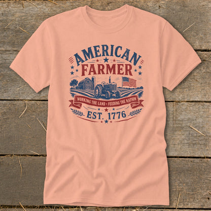 Peach t-shirt with American Farmer graphic, tractor, barn, and US flag.