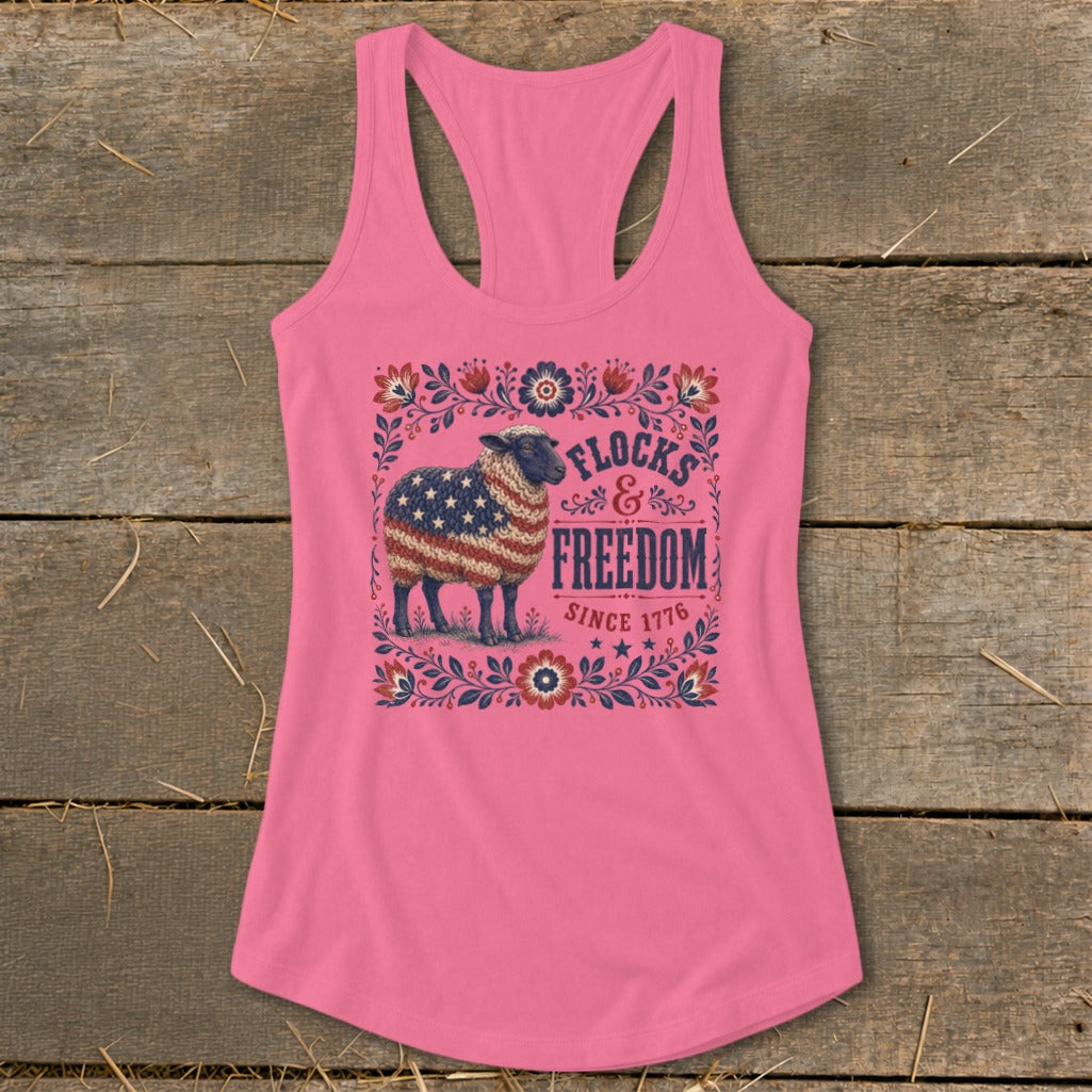 Pink tank top with a sheep design and "Flocks & Freedom Since 1776" text.