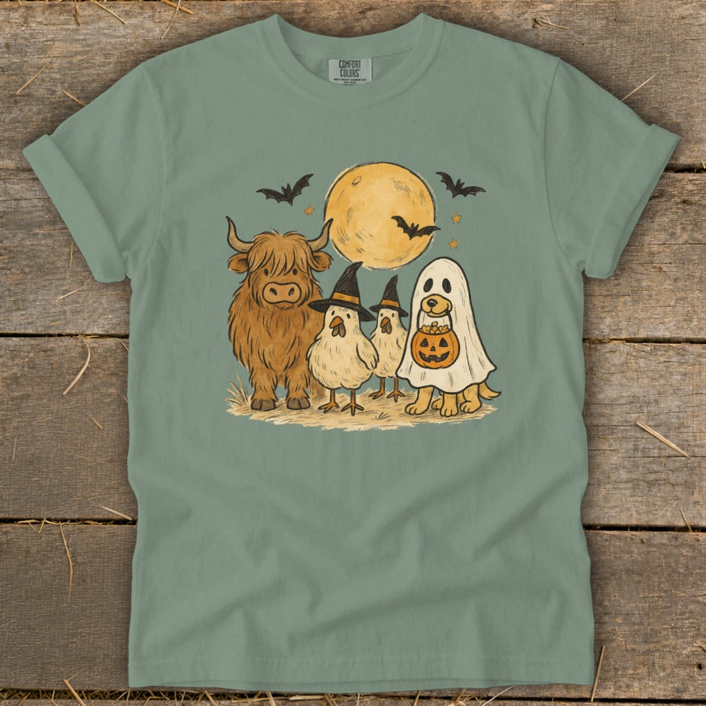 Halloween graphic of a Highland cow, chicks in witch hats, and a dog in a ghost costume.