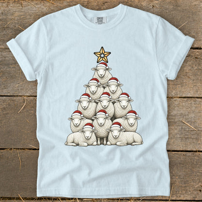 White t-shirt with a Christmas tree made of sheep wearing Santa hats and a star.
