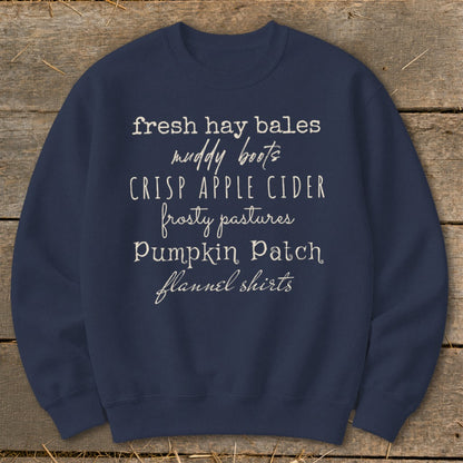 Navy sweatshirt with text listing fall activities and apparel.