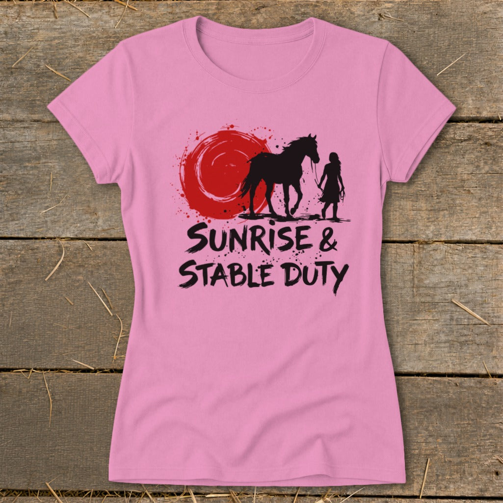 Pink t-shirt with black horse, girl silhouette, red sun, and text "SUNRISE & STABLE DUTY".