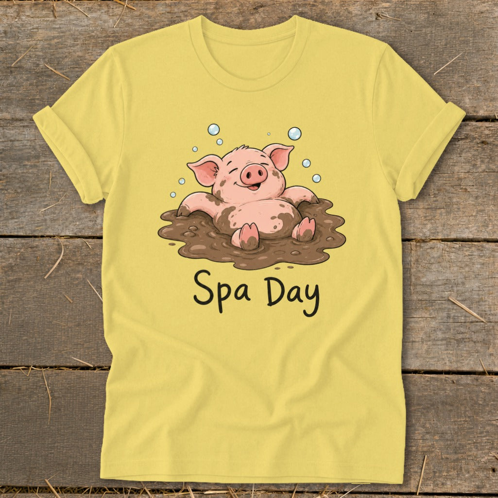 Yellow t-shirt with a cartoon pig relaxing in mud and text "Spa Day".