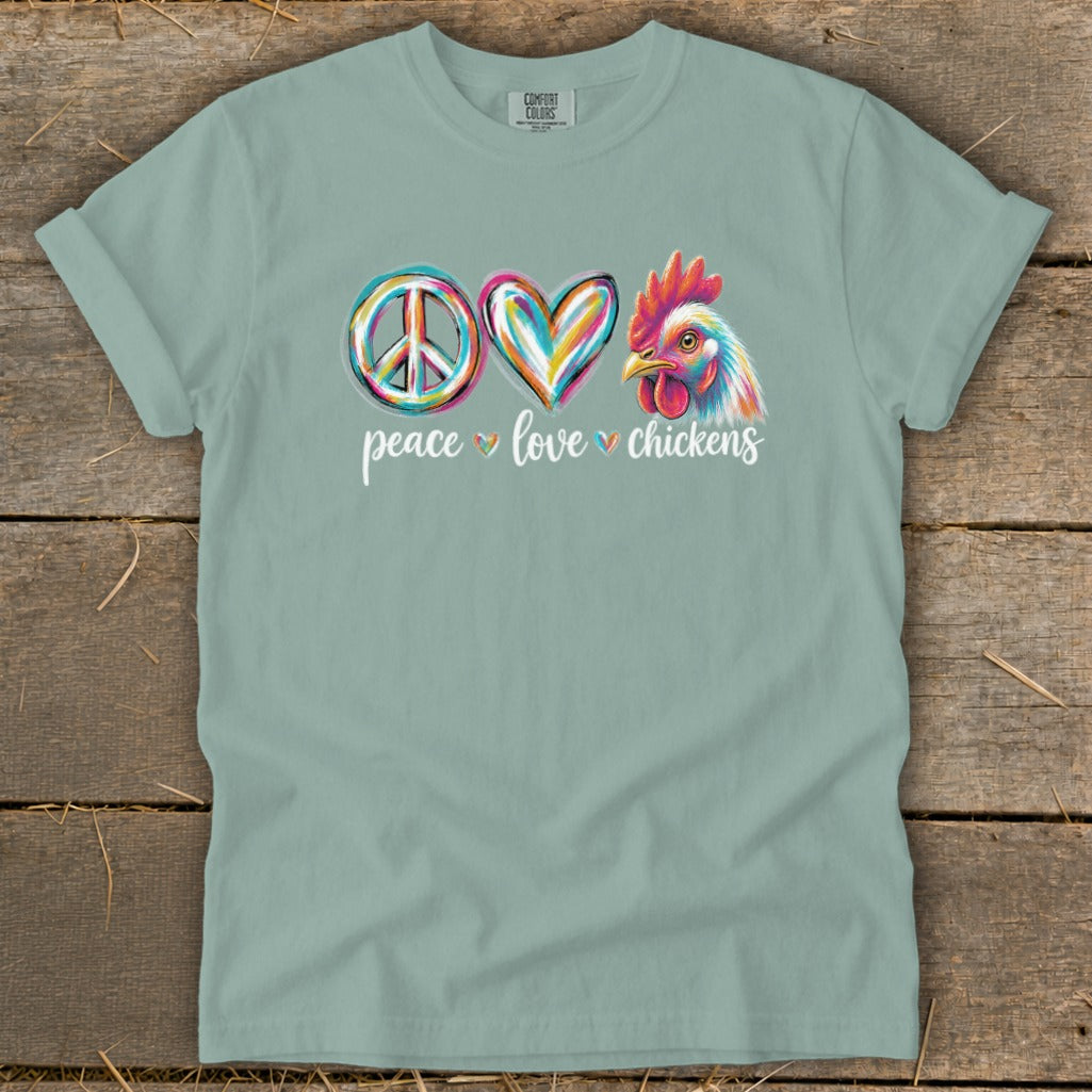 Peace, love, chickens graphic on a light blue t-shirt with Comfort Colors logo.