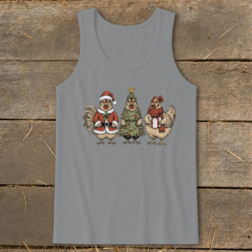Three chickens in Christmas attire, including Santa suit, tree costume, and gift.
