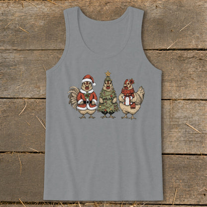 Three chickens in Christmas attire, including Santa suit, tree costume, and gift.