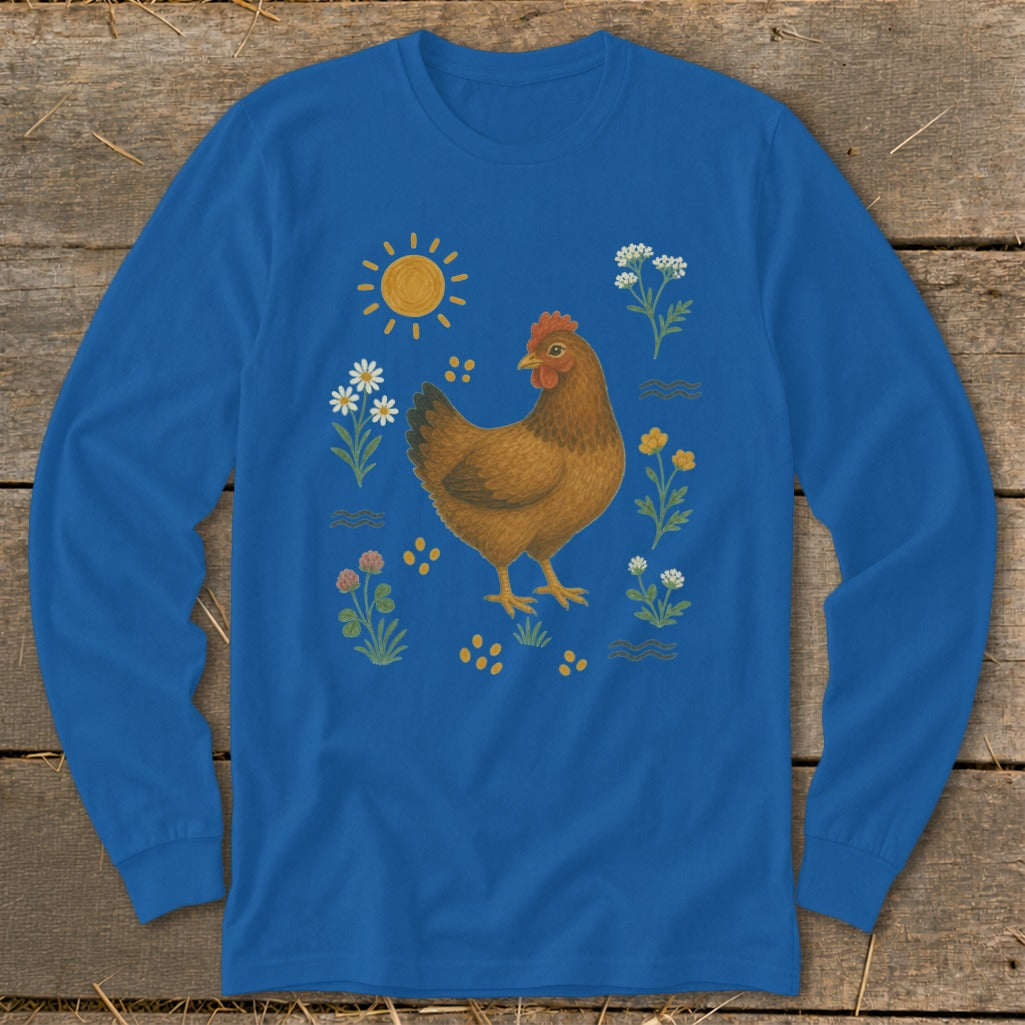 Blue long-sleeve shirt with illustration of a chicken, sun, flowers, and seeds.