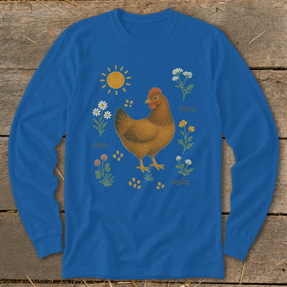 Blue long-sleeve shirt with illustration of a chicken, sun, flowers, and seeds.