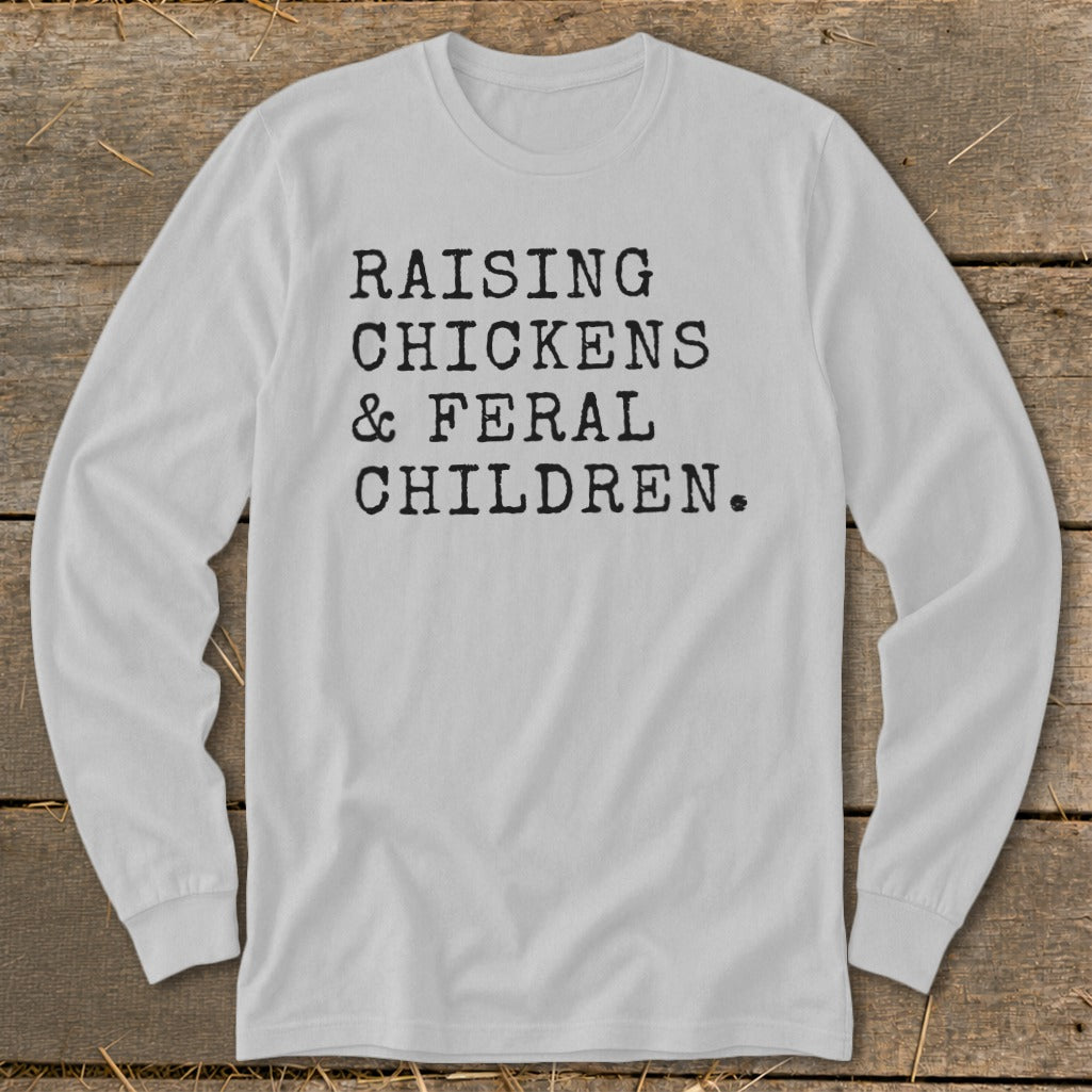 Light grey long sleeve shirt with black text reading "RAISING CHICKENS & FERAL CHILDREN."