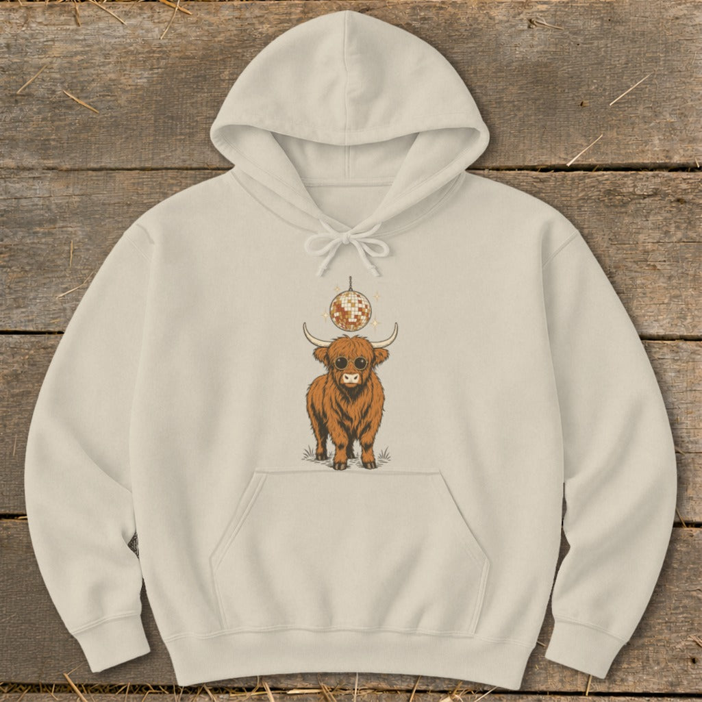 Cream hoodie with a graphic of a fluffy cow wearing sunglasses under a disco ball.