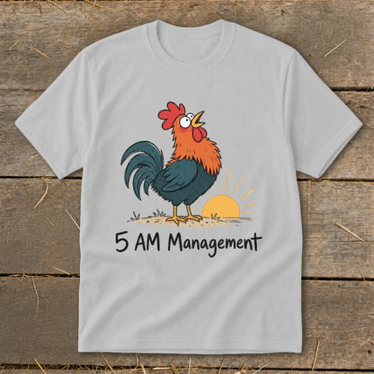 Light grey t-shirt with cartoon rooster crowing at sunrise with text "5 AM Management."