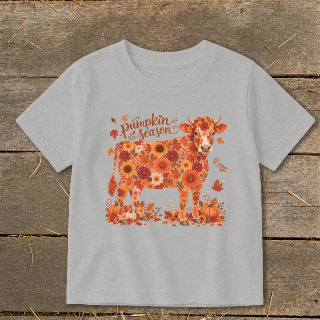 Light gray t-shirt with a cow illustration made of pumpkins and flowers, saying "pumpkin season".