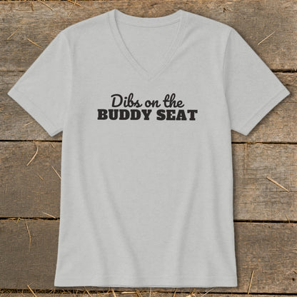 Light grey V-neck t-shirt with black text reading "Dibs on the BUDDY SEAT".