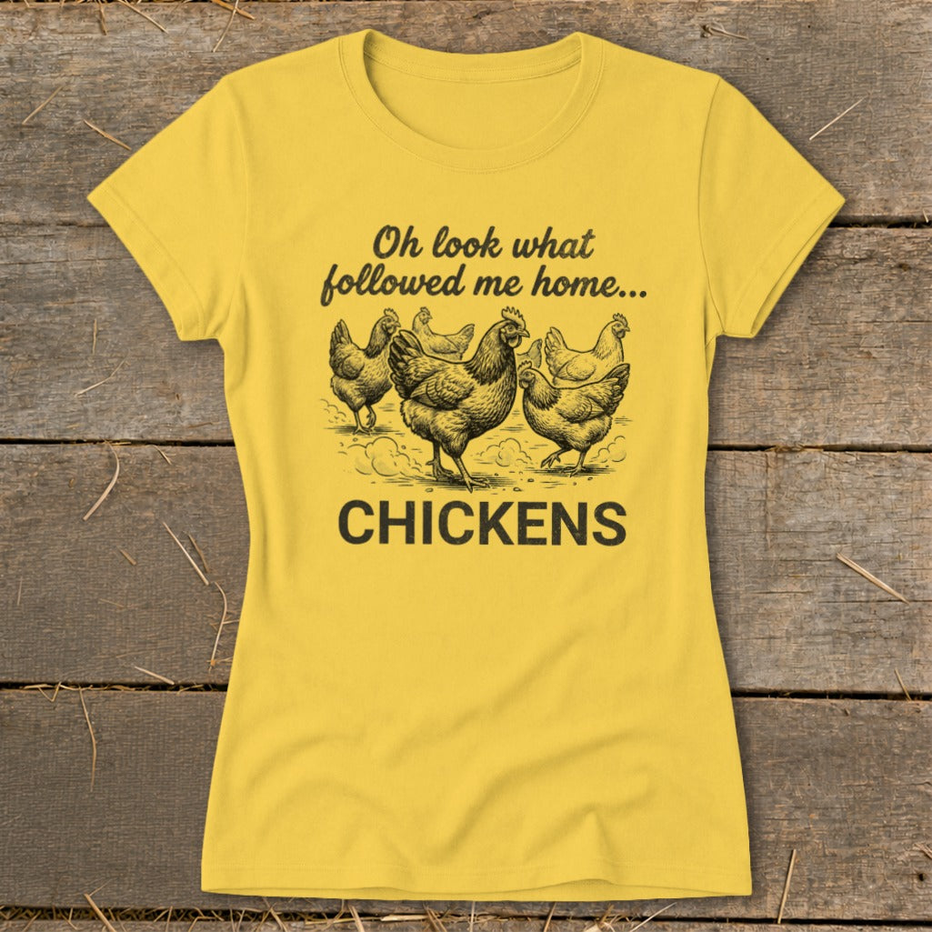 Yellow t-shirt with black text "Oh look what followed me home..." and drawing of chickens.