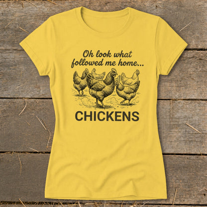 Yellow t-shirt with black text "Oh look what followed me home..." and drawing of chickens.