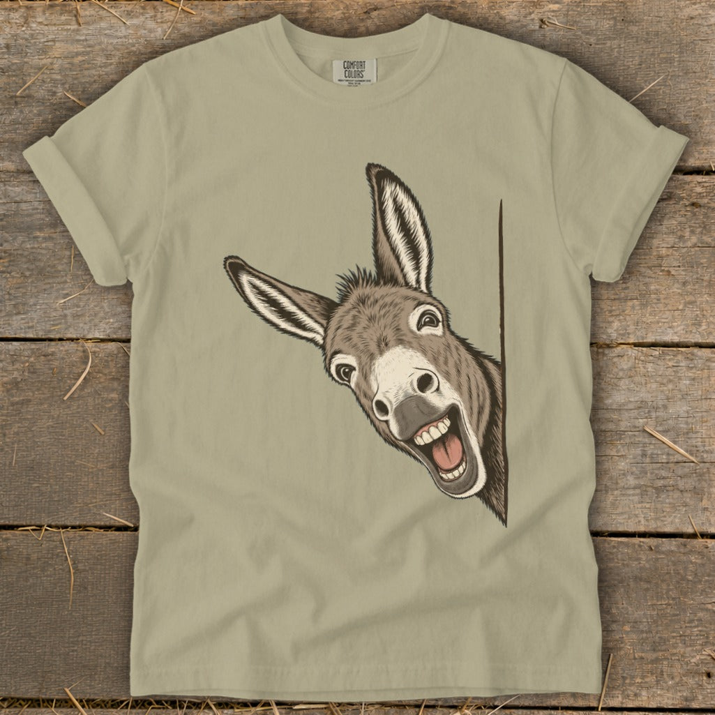 T-shirt with a graphic of a smiling donkey peeking from the side.