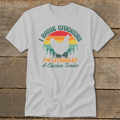White t-shirt with vintage sunset graphic and text "I RAISE CHICKENS I'M LITERALLY A CHICKEN TENDER".