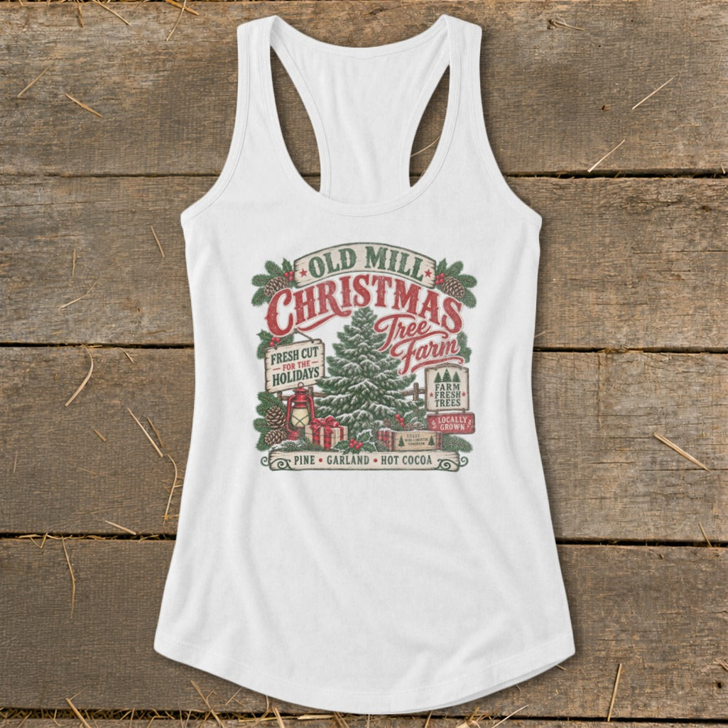 White tank top with "Old Mill Christmas Tree Farm" graphic featuring trees, gifts, and holiday text.