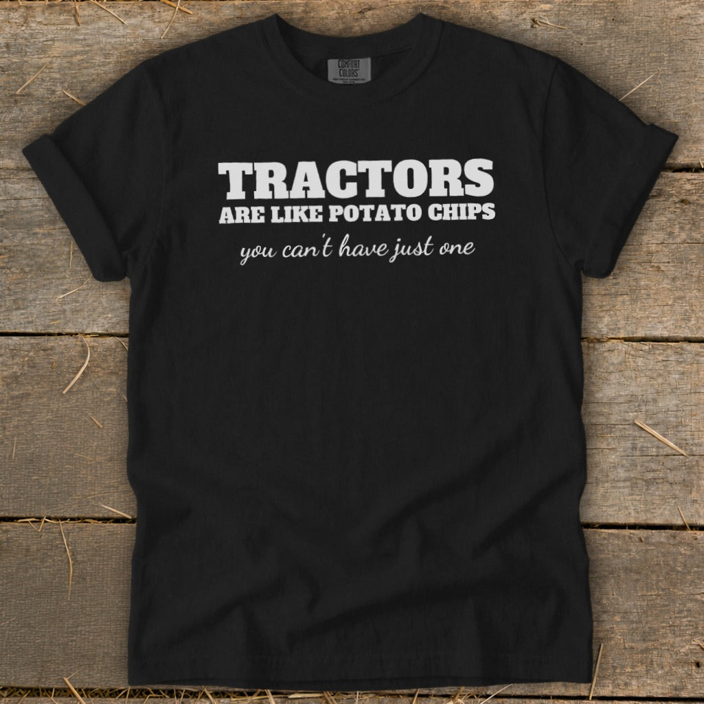 Black t-shirt with white text: "TRACTORS ARE LIKE POTATO CHIPS you can't have just one"