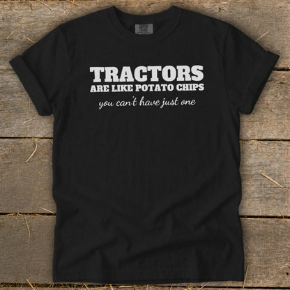Black t-shirt with white text: "TRACTORS ARE LIKE POTATO CHIPS you can't have just one"