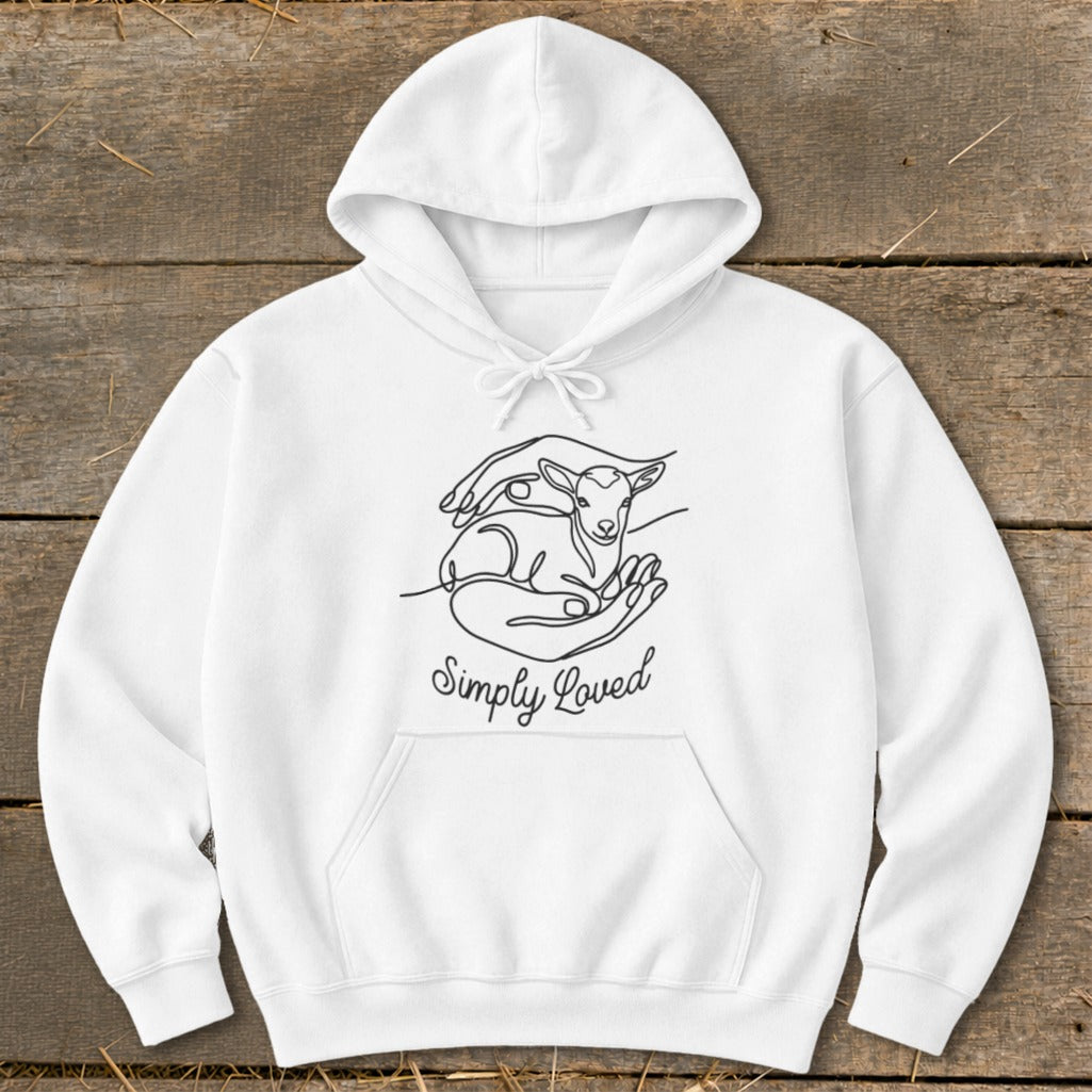 White hoodie with a line drawing of hands holding a lamb and the text "Simply Loved".
