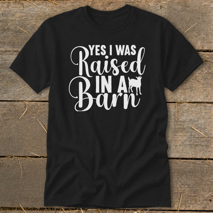 Black t-shirt with white text and a goat silhouette saying "Yes I was raised in a barn".