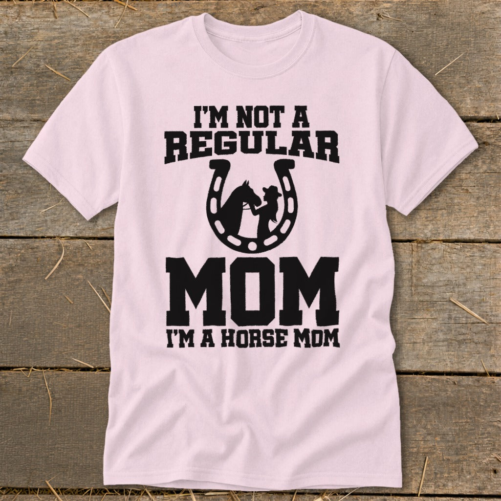 Pink t-shirt with "I'm not a regular mom. I'm a horse mom" text and horseshoe graphic.