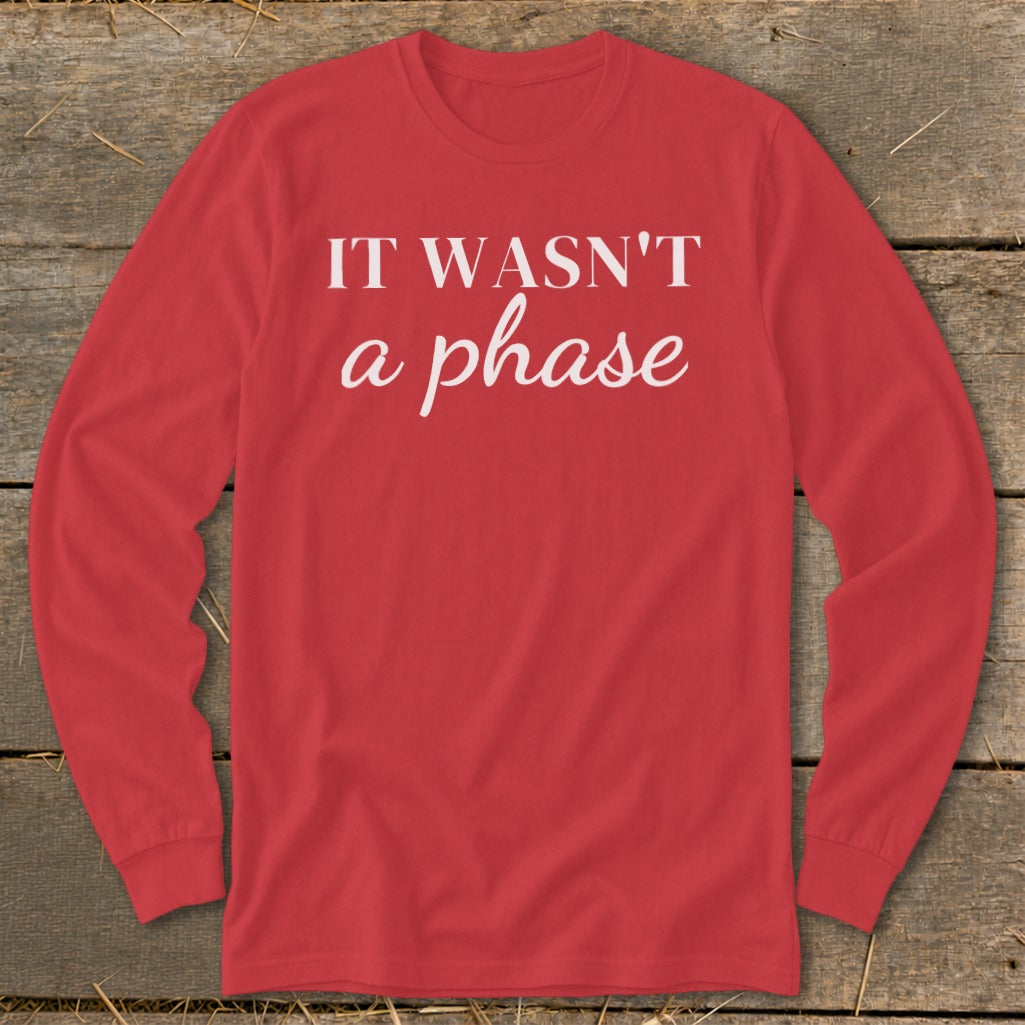 Red long-sleeve shirt with white text: "IT WASN'T a phase".