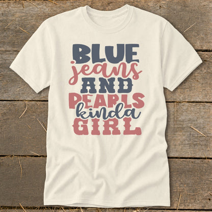 Cream t-shirt with "BLUE jeans AND PEARLS kinda GIRL" text in red, blue, and pink.
