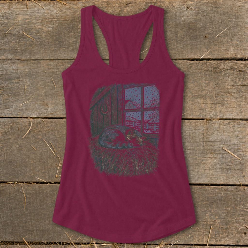 Maroon tank top with a print of a cat sleeping in hay by a window during a snowfall.