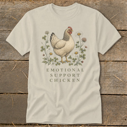 Light-colored t-shirt with an "Emotional Support Chicken" graphic featuring a hen among flowers.