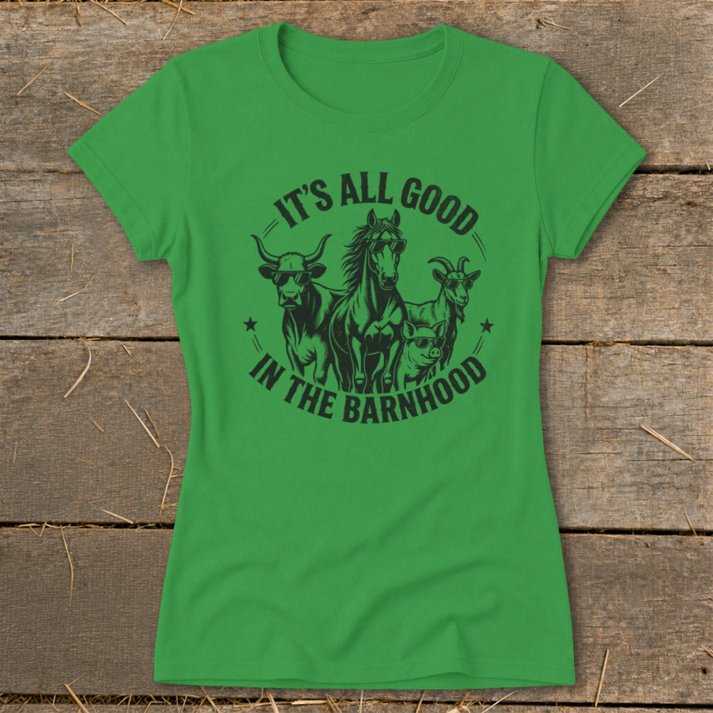 Green t-shirt with black graphic of cow, horse, pig, and goat wearing sunglasses with text "IT'S ALL GOOD IN THE BARNHOOD".