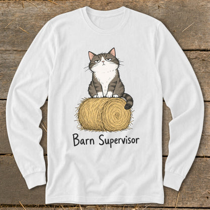 White long-sleeve shirt with a grumpy cat sitting on a hay bale, text reads "Barn Supervisor".
