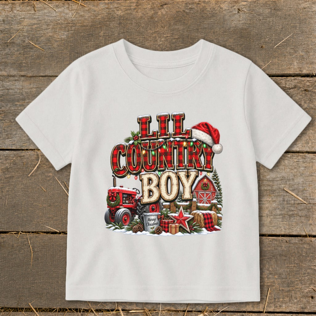 White t-shirt with "Lil Country Boy" Christmas graphic, tractor, and barn.