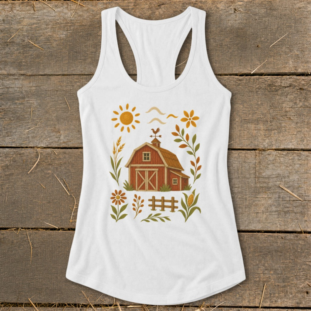 White tank top with a rustic barn, sun, and floral graphic.